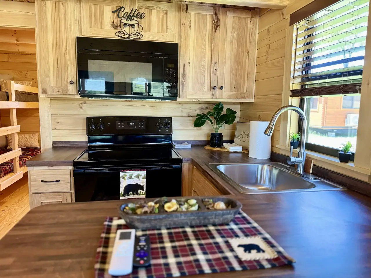 Cabin kitchen with full-size stove, microwave and sink