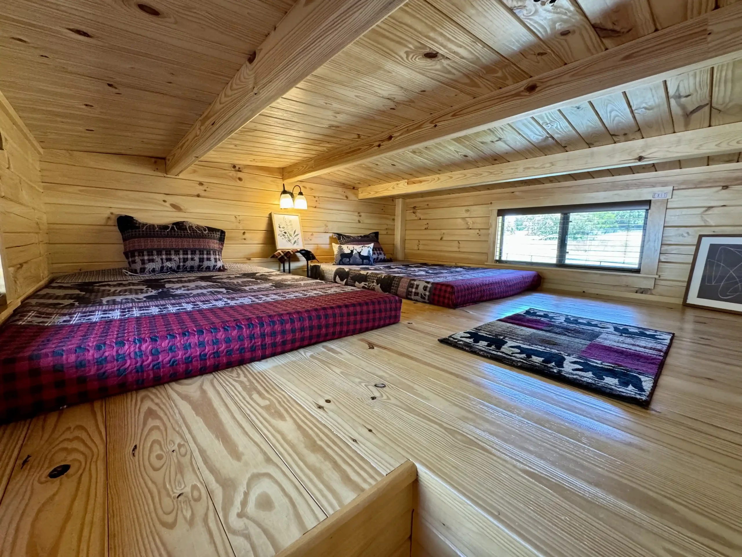 Cabin loft sleeping area with ladder access