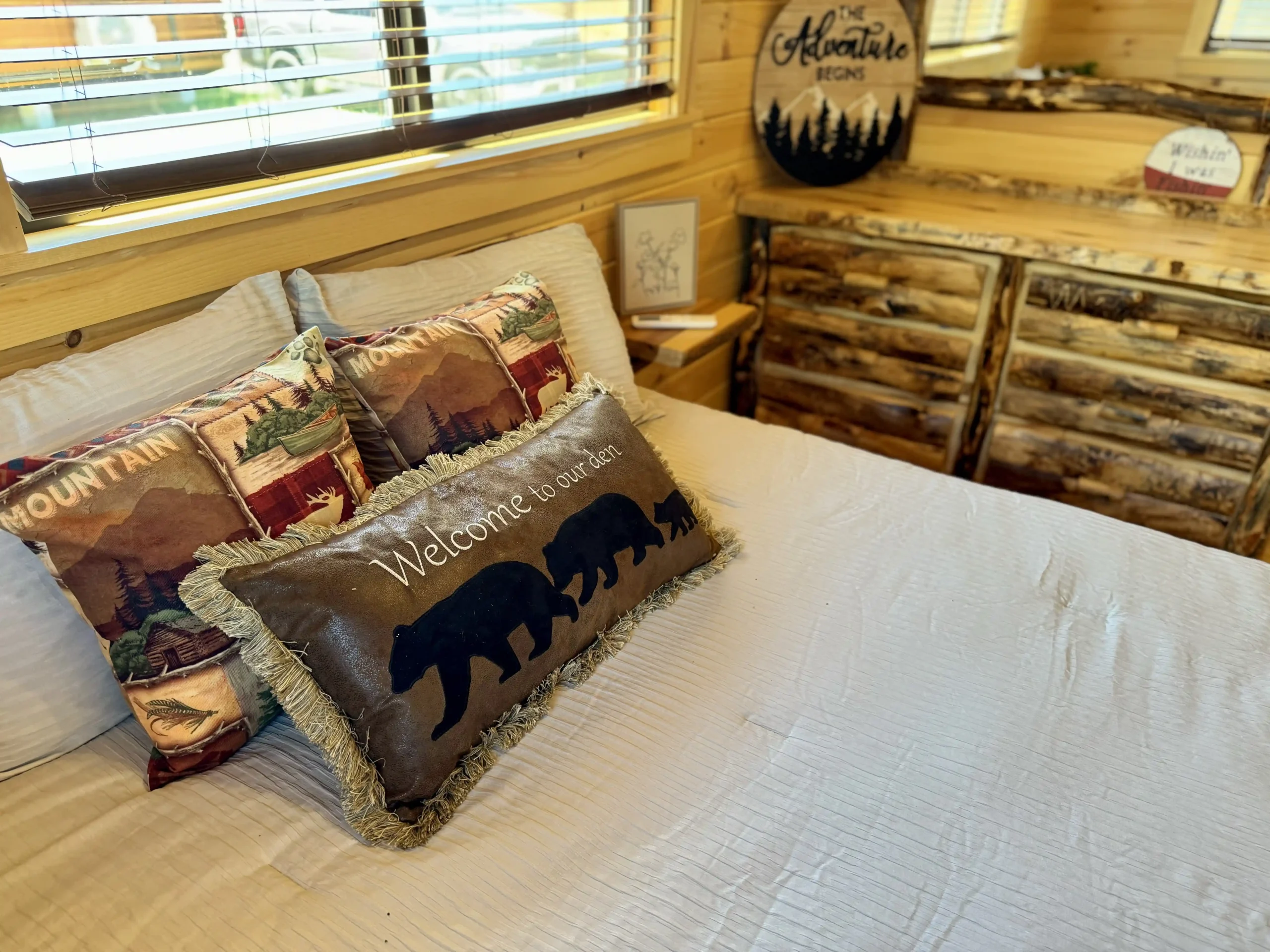 Cozy bedroom with queen bed in cabin
